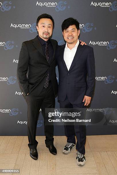 Gary Zhang and JJ Kim attend the 2014 Cannes Aquamen KONG Event At Mandala Beach / Cheri Cheri during the 67th Annual Cannes Film Festival at Mandala...