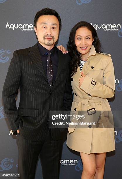 Gary Zhang and Lois Xu attend the 2014 Cannes Aquamen KONG Event At Mandala Beach / Cheri Cheri during the 67th Annual Cannes Film Festival at...