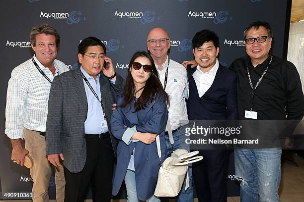 Kim and guests attend the 2014 Cannes Aquamen KONG Event At Mandala Beach / Cheri Cheri during the 67th Annual Cannes Film Festival at Mandala Beach...