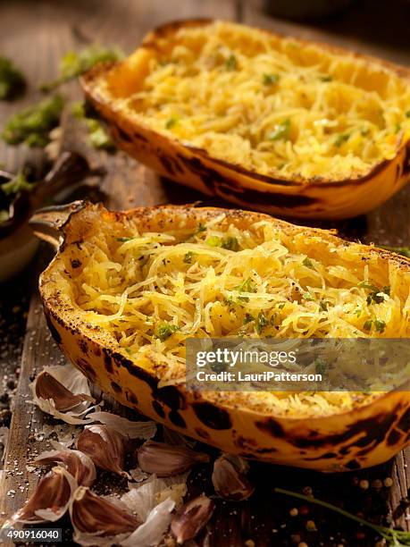 roasted spaghetti squash with garlic herb butter - winter squash stock pictures, royalty-free photos & images