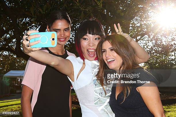 Samantha Harris, Dami Im and Ada Nicodemou pose for a 'selfie' during a world record attempt at the longest selfie during a 'You Beauty' campaign...