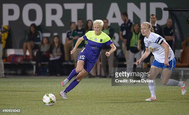 Megan Rapinoe of Seattle Reign FC brings the ball up the pitch during the first half of the game against the FC Kansas City at Providence Park on...
