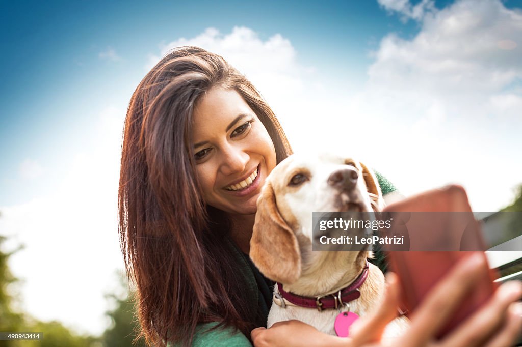 Pet owner and her dog taking a selfie