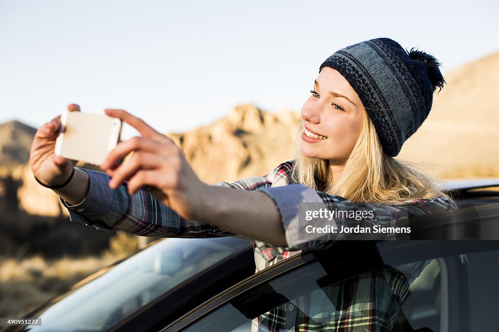 A woman taking a selfie.