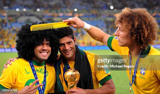 Daniel Alves celebrates with team-mates Hulk and David Luiz of Brazil at the end of the FIFA Confederations Cup Brazil 2013 Final match between...