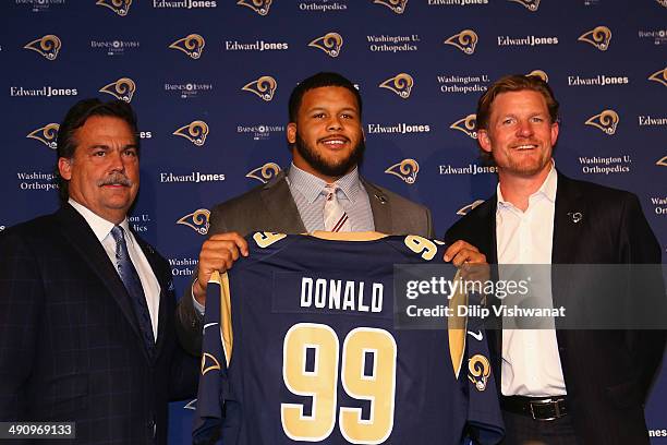 St. Louis Rams head coach Jeff Fischer, first-round draft pick Aaron Donald and general manager Les Snead pose for a photograph during a press...