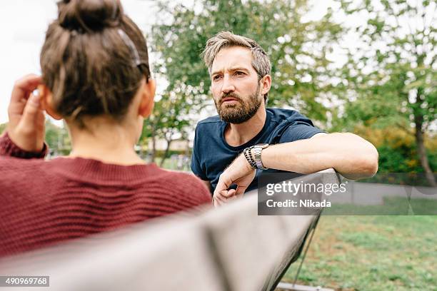 father and daughter talking - two girls bildbanksfoton och bilder