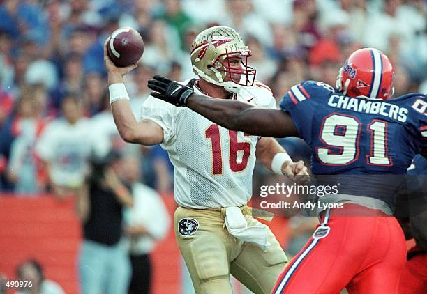 Chris Weinke of the Florida State Seminoles gets ready to pass the ball during the game against the Florida Gators at the Ben HillGriffin Stadium in...