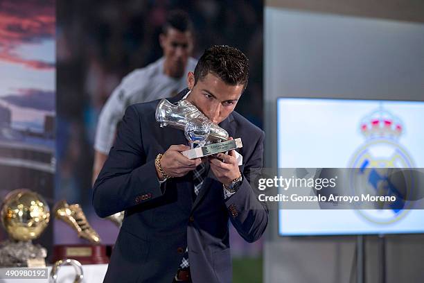 Cristiano Ronaldo kisses his trophy as all-time top scorer of of Real Madrid CF at Honour box-seat of Santiago Bernabeu Stadium on October 2, 2015 in...