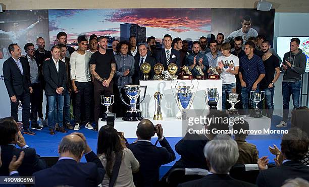 Cristiano Ronaldo poses for a picture with his trophy as all-time top scorer of Real Madrid CF lines up with president Florentino Perez and all his...