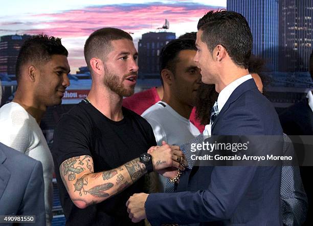 Cristiano Ronaldo shakes hands with his teammate Sergio Ramos after receiving his trophy as all-time top scorer of of Real Madrid CF at Honour...