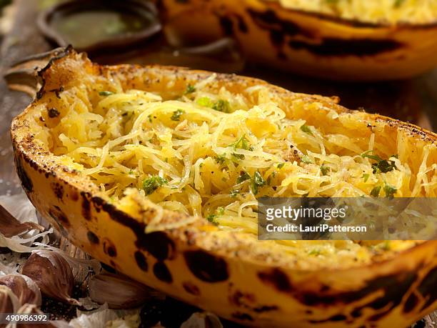 roasted spaghetti squash with garlic herb butter - spaghetti squash stock pictures, royalty-free photos & images