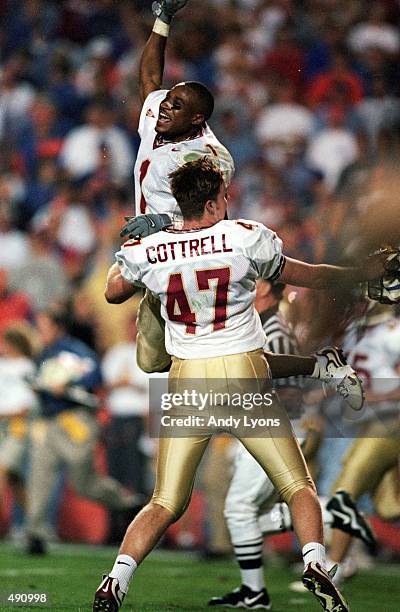 Reggie Durden of the Florida State Seminoles celebrates with teammate Kieth Cottrell during the game against the Florida Gators at the Ben...