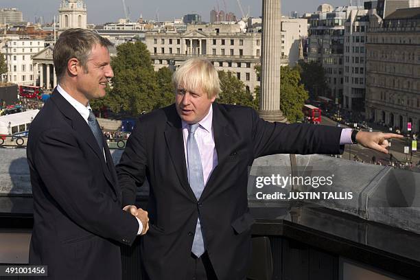 British Conservative MP for Richmond Park, and London 2016 mayoral candidate, Zac Goldsmith , poses for photographers with current Mayor of London...