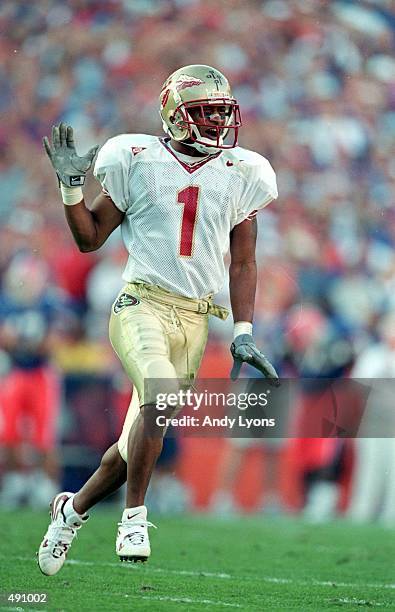 Reggie Durden of the Florida State Seminoles celebrates on the field during the game against the Florida Gators at the Ben HillGriffin Stadium in...