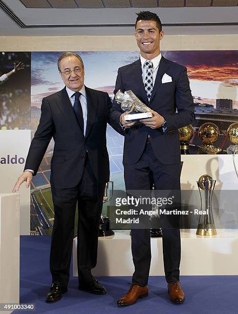 Cristiano Ronaldo receives the trophy as all-time top scorer of Real Madrid CF from president Florentino Perez at Honour box-seat of Santiago...