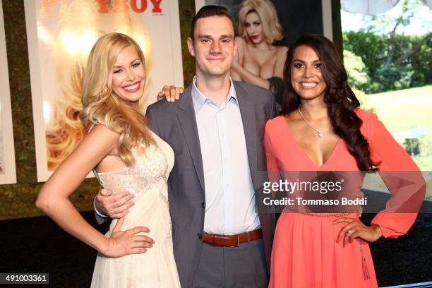 Playmate Of The Year Kennedy Summers, Cooper Hefner and 2013 Playmate Of The Year Raquel Pomplun attend the Playboy's 2014 "Playmate Of The Year"...