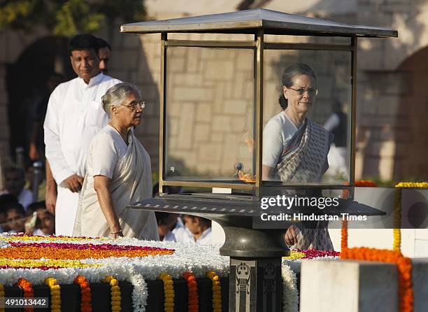 Congress President Sonia Gandhi and former member of Legislative Assembly, Sheila Dikshit pay tribute to Mahatma Gandhi on his 146th birth...