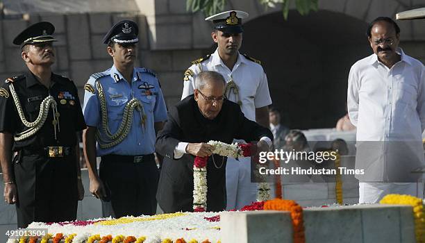 President Pranab Mukherjee pays tribute to Mahatma Gandhi on his 146th birth anniversary at Rajghat on October 2, 2015 in New Delhi, India....