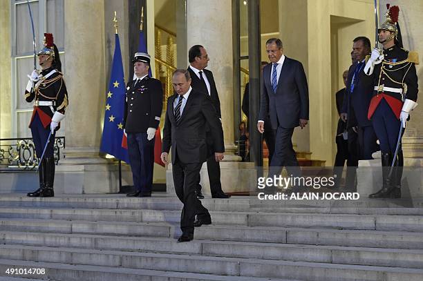 French president Francois Hollande escorts Russian president Vladimir Putin and Russian Foreign Affairs minister Serguei Lavrov out of the Elysee...