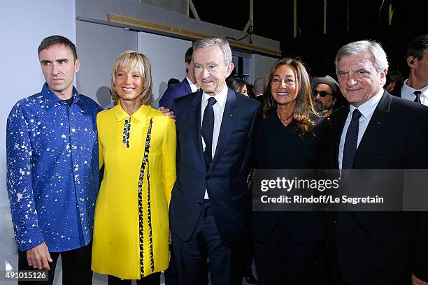 Fashion Designer Raf Simons, Owner of LVMH Luxury Group Bernard Arnault with his wife Helene Arnault and CEO Dior Sidney Toledano and his wife Katia...