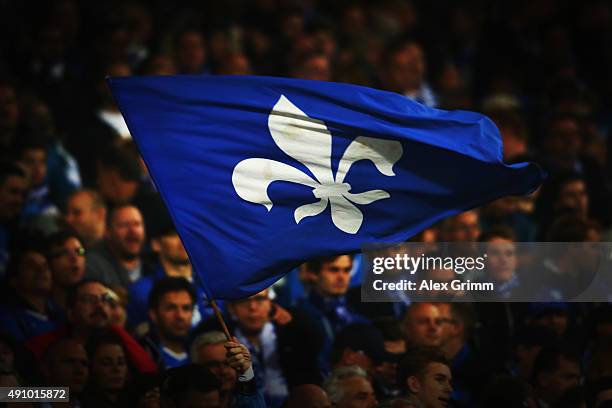 Fans of Darmstadt wave their flags prior to the Bundesliga match between SV Darmstadt 98 and 1.FSV Mainz 05 at Merck-Stadion am Boellenfalltor on...