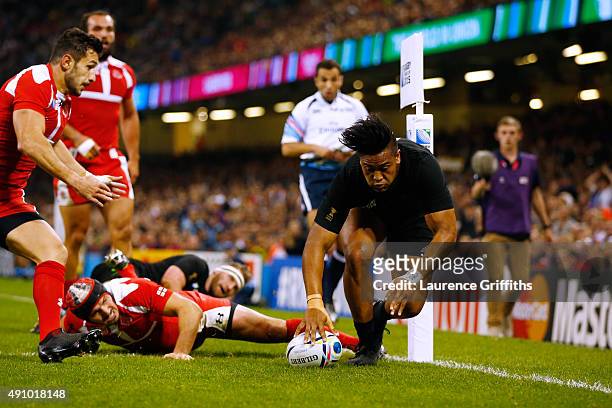 Julian Savea of the New Zealand All Blacks goes over to score their second try during the 2015 Rugby World Cup Pool C match between New Zealand and...