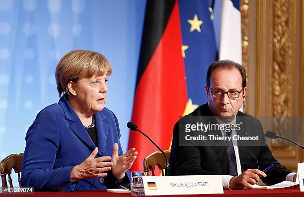German Chancellor Angela Merkel and French President Francois Hollande hold a press conference following a summit on Ukraine on 02 October 2015, in...