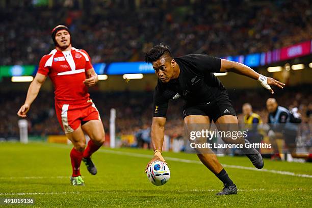 Julian Savea of the New Zealand All Blacks goes over to score their third try during the 2015 Rugby World Cup Pool C match between New Zealand and...