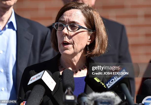 Oregon Governor Kate Brown reacts during a press conference in Roseburg, Oregon on October 2, 2015. As police and mourners groped for answers in the...