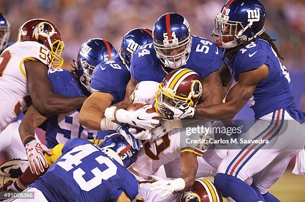 Washington Redskins Rashad Ross in action vs New York Giants Jonathan Casillas , Nikita Whitlock , Craig Dahl and Geremy Davis at MetLife Stadium....