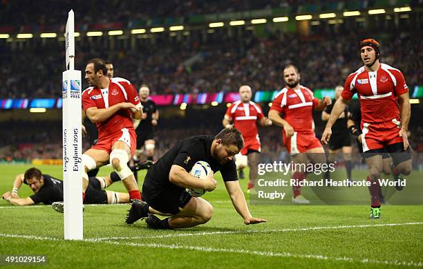 Dane Coles of the New Zealand All Blacks scores their fourth try during the 2015 Rugby World Cup Pool C match between New Zealand and Georgia at the...
