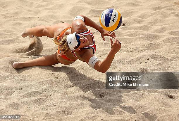 Madelein Meppelink of the Netherlands plays a shot during a match against Agatha Bednarczuk and Barbara Seixas of Brazil at the FIVB Fort Lauderdale...