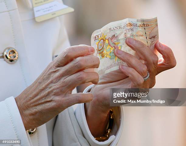 Sophie, Countess of Wessex holds a ten pound note as she attends the Autumn Racing & CAMRA Beer Festival meet at Ascot Racecourse on October 2, 2015...