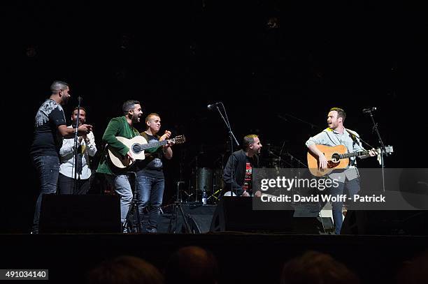 Elijah Wolf is joined on stage by Gipsy Kings musicians at L'Olympia on October 2, 2015 in Paris, France.