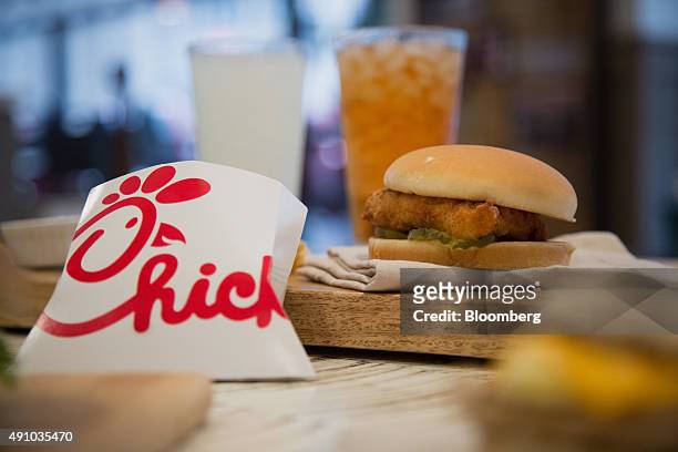 French fries and a fried chicken sandwich are arranged for a photograph during an event ahead of the grand opening for a Chick-fil-A restaurant in...