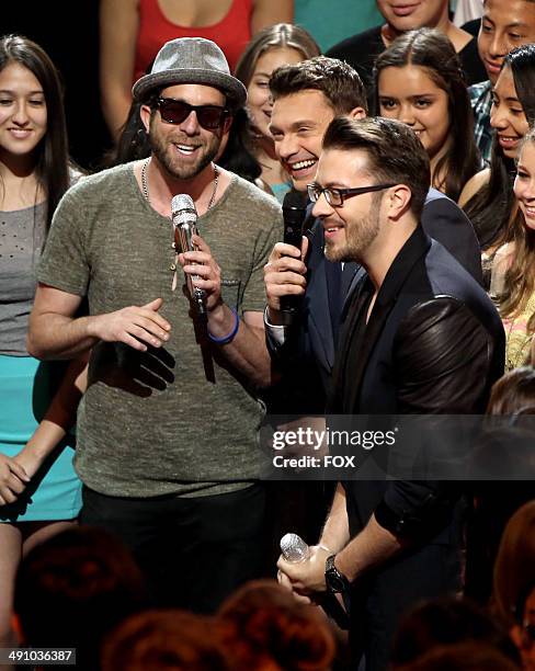 Singer Elliott Yamin, host Ryan Seacrest and singer Danny Gokey in the audience at FOX's "American Idol XIII" Top 3 to 2 Live Performance Show on May...