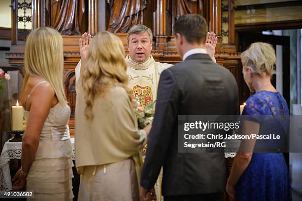 Father William McCandless, Lynette Wittstock, Gareth Wittstock, Roisin Galvin Wittstock and Pauline Galvin attend the wedding ceremony of Gareth...