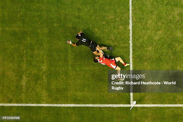 Julian Savea of the New Zealand All Blacks scores his team's sixth try and completes his hat trick as Giorgi Aptsiauri of Georgia challenges during...