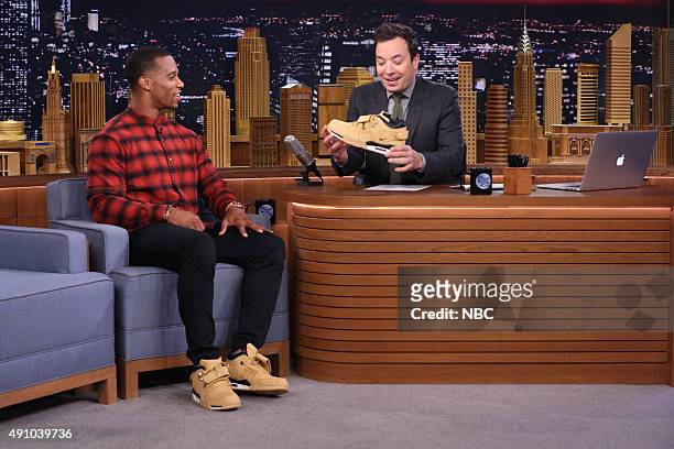 Episode 0342 -- Pictured: Professional football player Victor Cruz during an interview with host Jimmy Fallon on October 2, 2015 --
