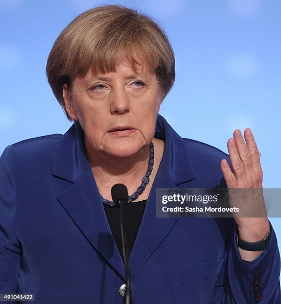 German Chancellor Angela Merkel speeches during a press conference after the Normandy Format Summit in the Elysee Palace on October 2, 2015 in Paris,...