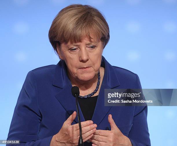 German Chancellor Angela Merkel speeches during a press conference after the Normandy Format Summit in the Elysee Palace on October 2, 2015 in Paris,...