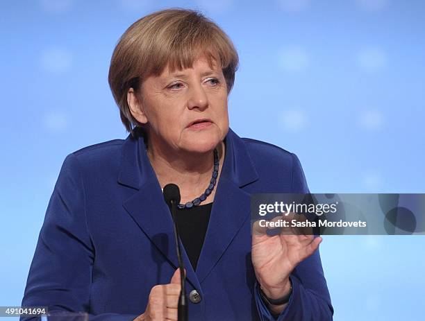 German Chancellor Angela Merkel speeches during a press conference after the Normandy Format Summit in the Elysee Palace on October 2, 2015 in Paris,...