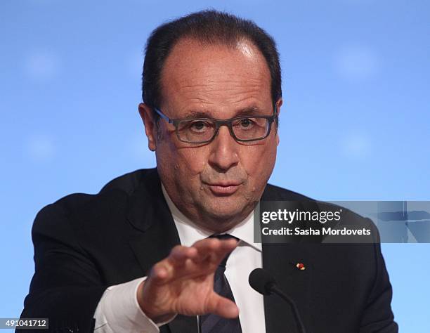 French President Francois Hollande gestures during a press conference after the Normandy Format Summit in the Elysee Palace on October 2, 2015 in...