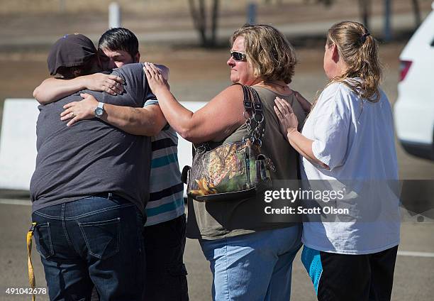 Students and staff of Umpqua Community College arrive at the Douglas County Fairgrounds Complex where they were offered grief counseling and a bus...