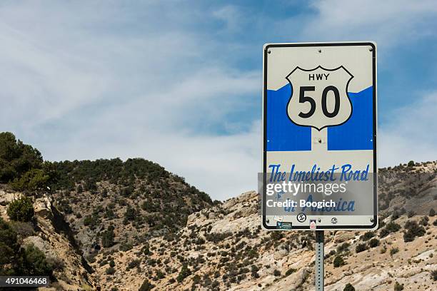 highway 50 loneliest road in america - nevada stock pictures, royalty-free photos & images