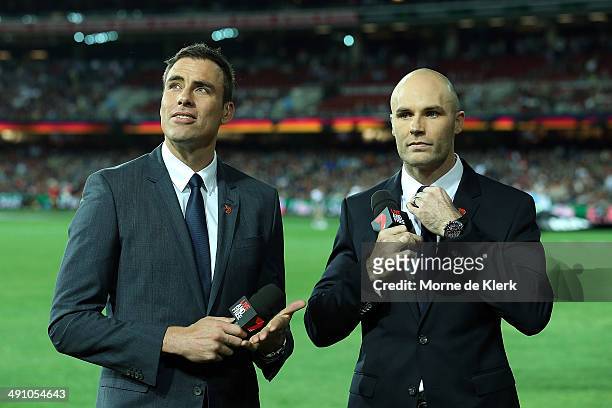 Commentators and former players Matthew Richardson and Tom Harley looks on during the round nine AFL match between the Adelaide Crows and the...