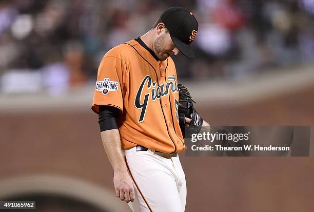 Chris Heston of the San Francisco Giants reacts after giving up a two-run RBI double to Jose Reyes of the Colorado Rockies in the top of the fourth...