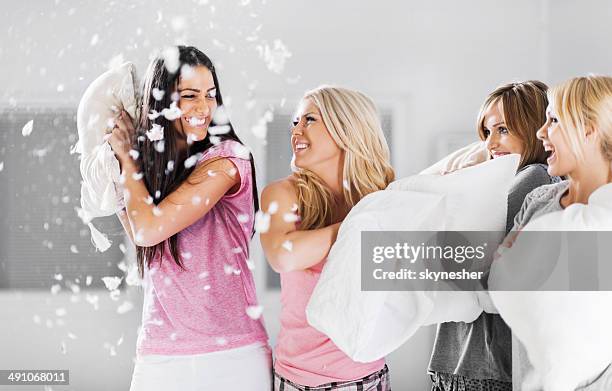 pillow fight! - pyjamas stock pictures, royalty-free photos & images