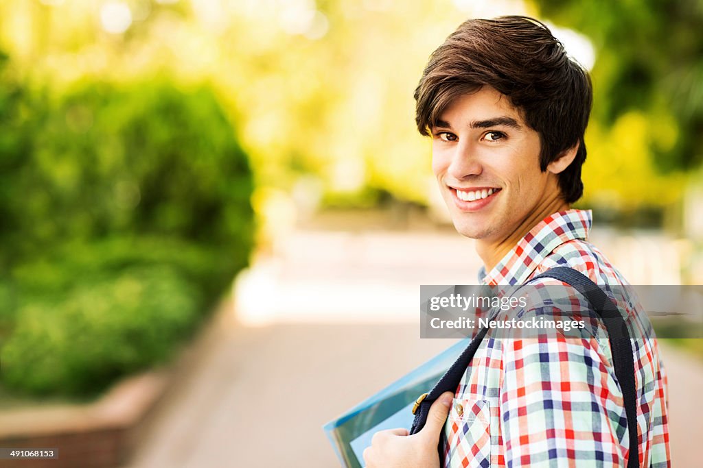 Happy Male Student On College Campus